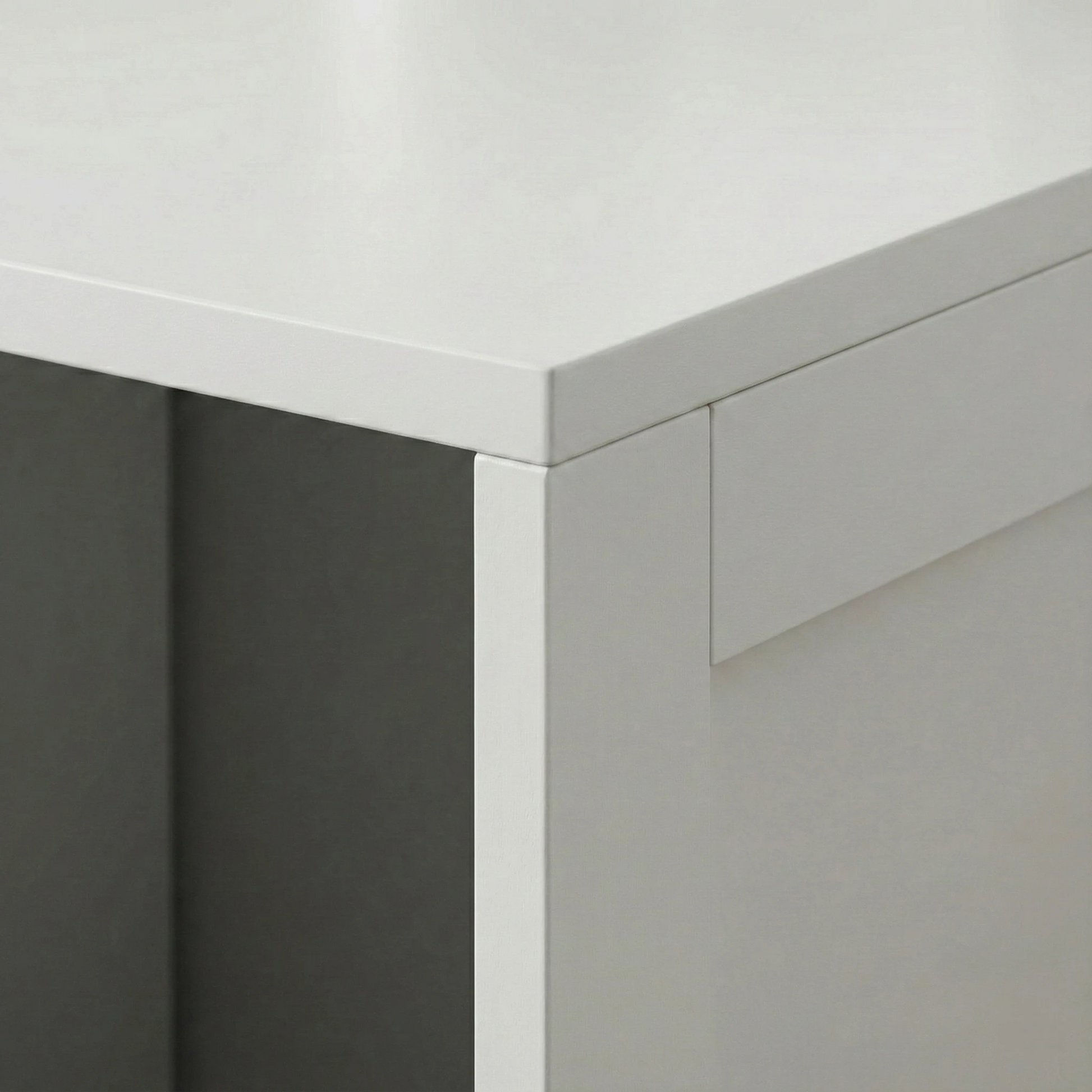 Détail angle finition meuble litière chat blanc design épuré